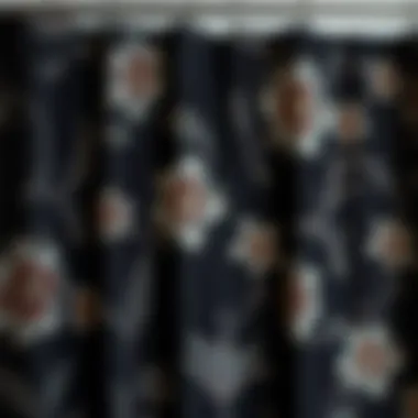 Close-up of intricate floral patterns on a black shower curtain