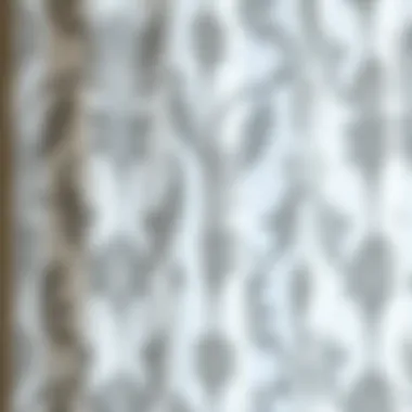 Intricate Gray Patterns on Sheer Fabric Close-up of white sheer fabric showcasing intricate gray patterns