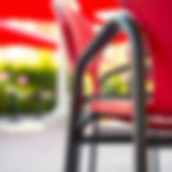Close-up of the material and texture of a red stacking patio chair.
