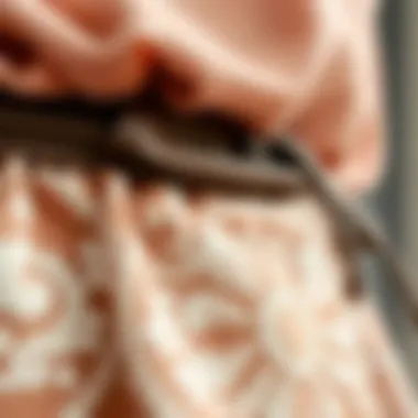 A close-up of intricately designed fabric detailing on decorative aprons.